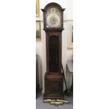 A 1930s oak cased grandmother clock; the weight driven movement faced by a brushed steel Roman dial,