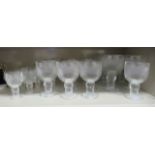 Glassware, three graduated sets of pedestal wines, each with moulded foliate ornament