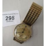 A 9ct gold cased JW Benson wristwatch, faced by a Roman and baton dial with subsidiary seconds, on a