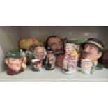 Royal Doulton china character jugs: to include 'Winston Churchill'  4"h; and 'The Snake Charmer'