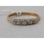 An 18ct gold fine stone diamond ring