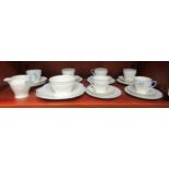 An Art Deco Shelley fine bone china tea set, comprising a cake plate, a sugar basin, cream jug and