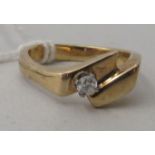 A 14ct gold ring, set with a diamond