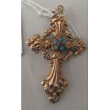 A yellow metal (possibly 14ct) crucifix pendant cross, set with garnet and turquoise