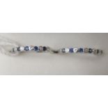 A pair of 18ct white gold sapphire and diamond half eternity rings