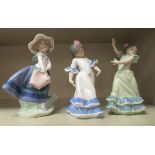 Three Lladro porcelain figures, two dancing children; and another, a child holding a basket of