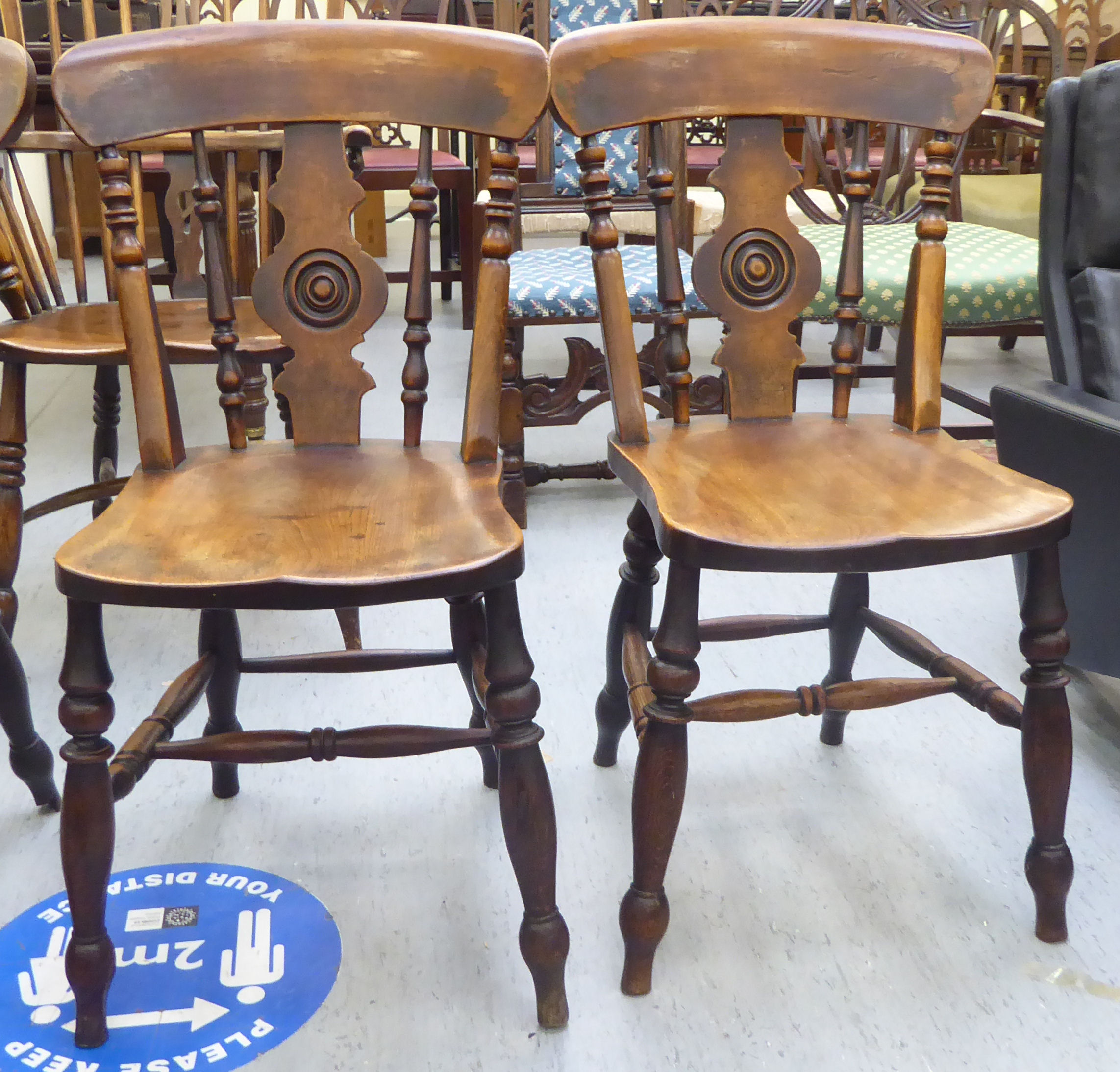 A set of four late Victorian beech and elm framed Windsor chairs, each with a spindled and roundel - Image 2 of 4