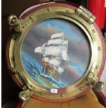 A 20thC brass porthole (divers salvage) later set with an unsigned seascape  oil on panel, mounted