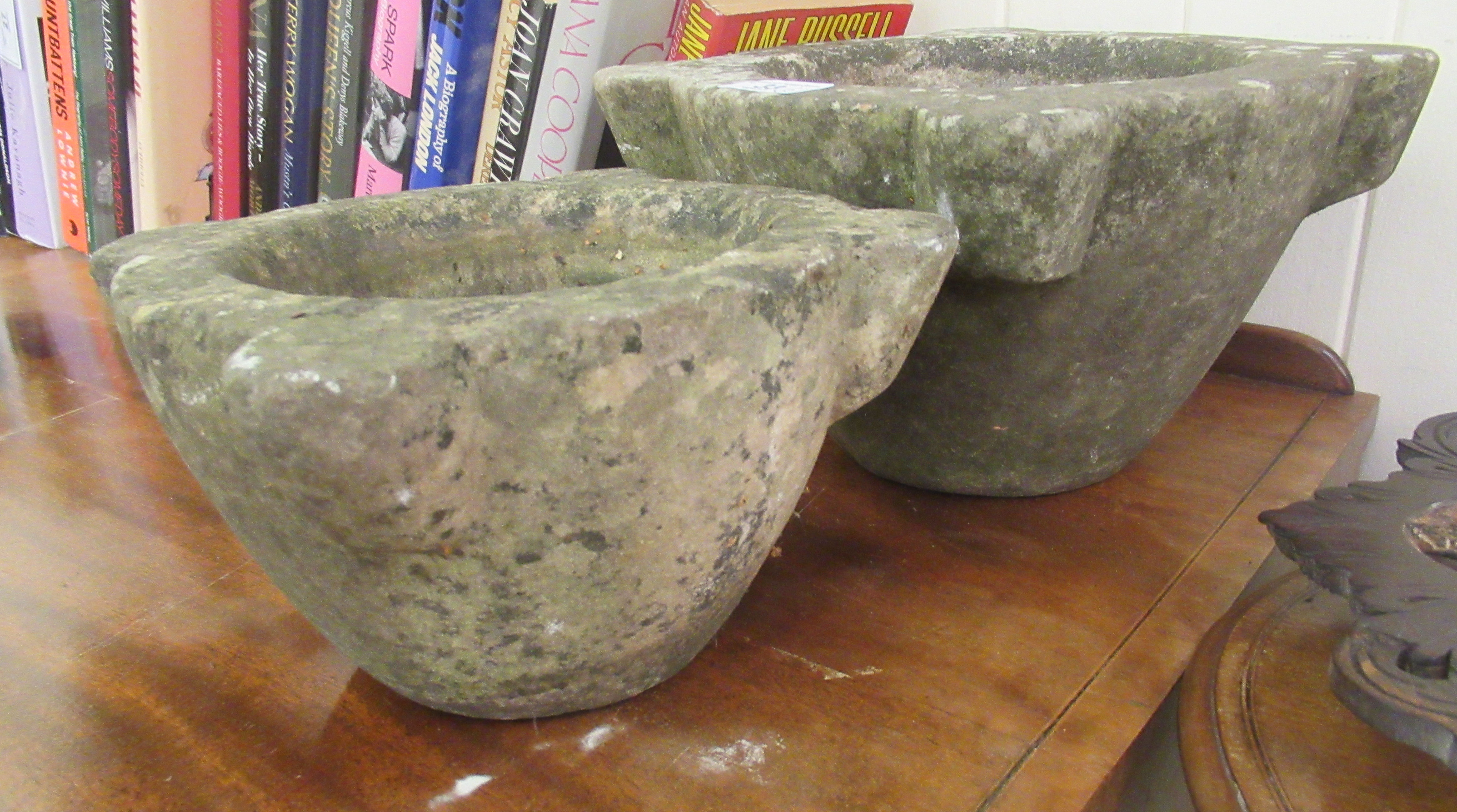 Two similar weathered composition stone mortars  6"h  12"dia and 5"h  10"dia