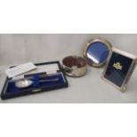 Modern silver items; viz. one round and another rectangular, glazed, photograph frames  4.5" x 3"