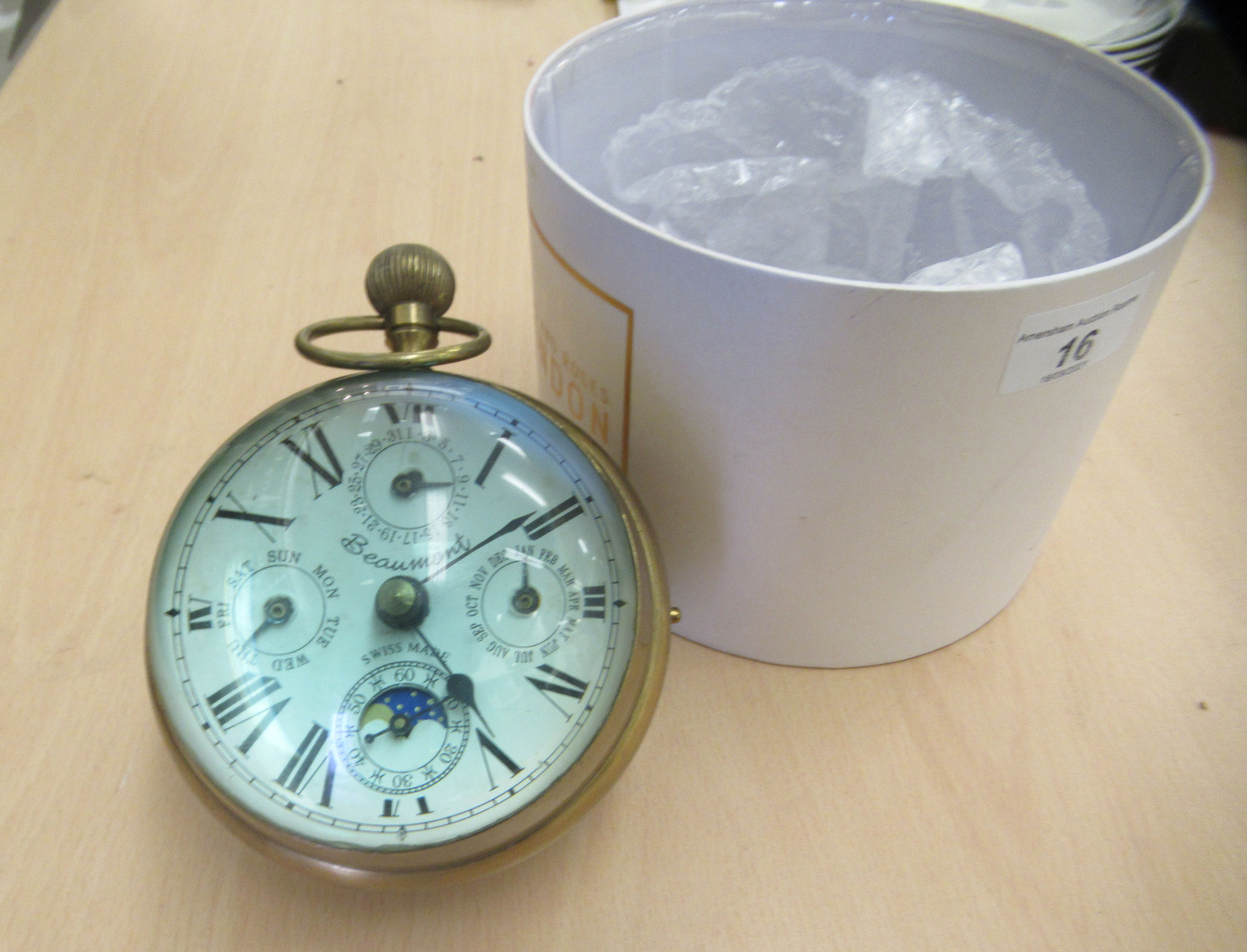 A 20thC lacquered brass and glazed desktop timepiece; faced by a Beaumont of Switzerland dial with