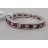 An 18ct white gold eternity ring, set with alternating diamonds and rubies
