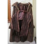 A three tone brown fur coat with a silk lining and a matching cape