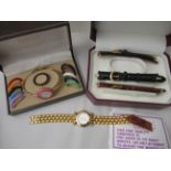 Ladies wristwatches: to include a Gucci yellow metal bracelet watch, faced by a plain white dial