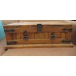 A mid 20thC stained pine box with metal strap work and opposing ring handles  8"h  22"w