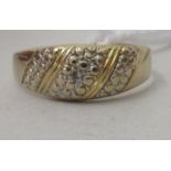 A 9ct gold and diamond set band ring