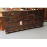 A Titchmarsh & Goodwin Old English style carved and panelled oak sideboard, comprising three