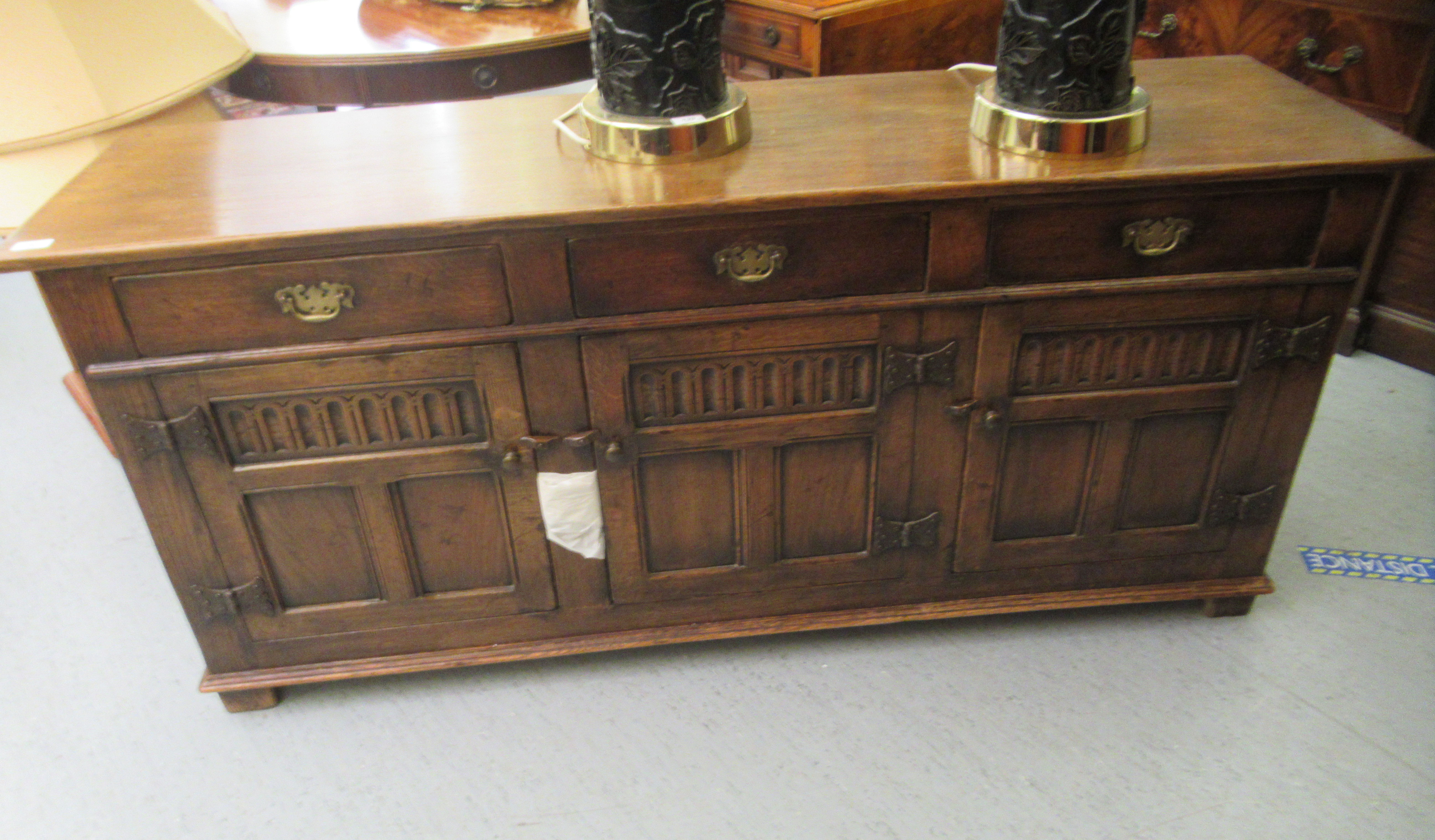 A Titchmarsh & Goodwin Old English style carved and panelled oak sideboard, comprising three - Image 2 of 4