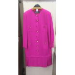 A Louis Feraud pink woollen dress with simulated pearl and black enamel buttons  size 18