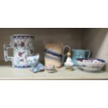 Decorative ceramics: to include a 19thC oversize tankard, decorated in blue and white in Chinese