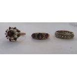 Three 9ct gold rings: to include an eternity ring, set with white coloured stones