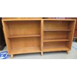 A 1970s Vanson bleached teak, open front, dwarf bookcase with height adjustable shelves, raised on