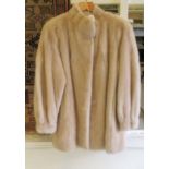 A blonde mink jacket with an embroidered lining  size 16