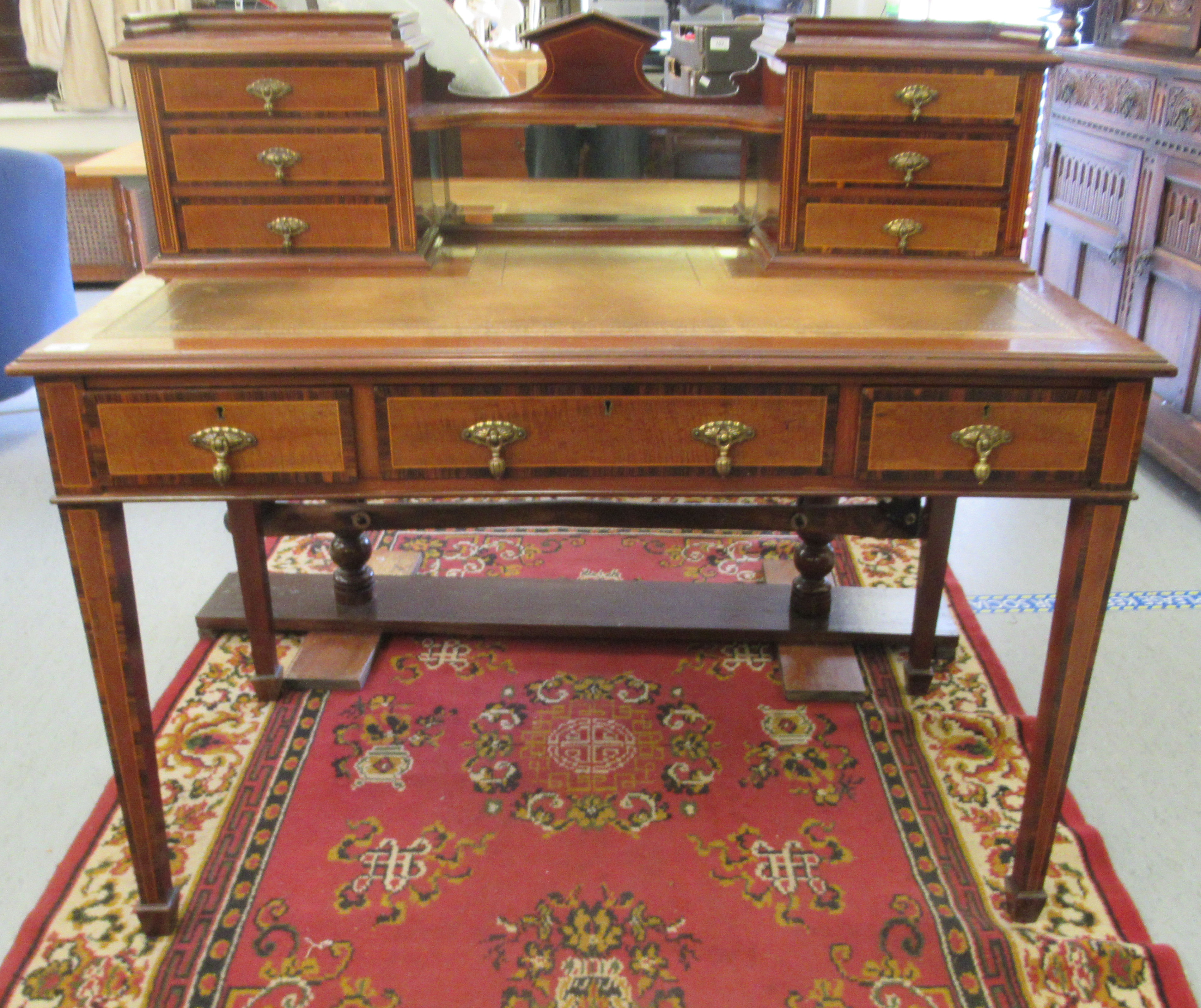 An Edwardian lady's crossbanded and satinwood inlaid mahogany writing desk, the superstructure