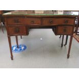 A modern mahogany finished serpentine front desk, comprising two short/two long drawers, raised on