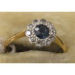 An early 20thC 18ct gold diamond and sapphire cluster ring