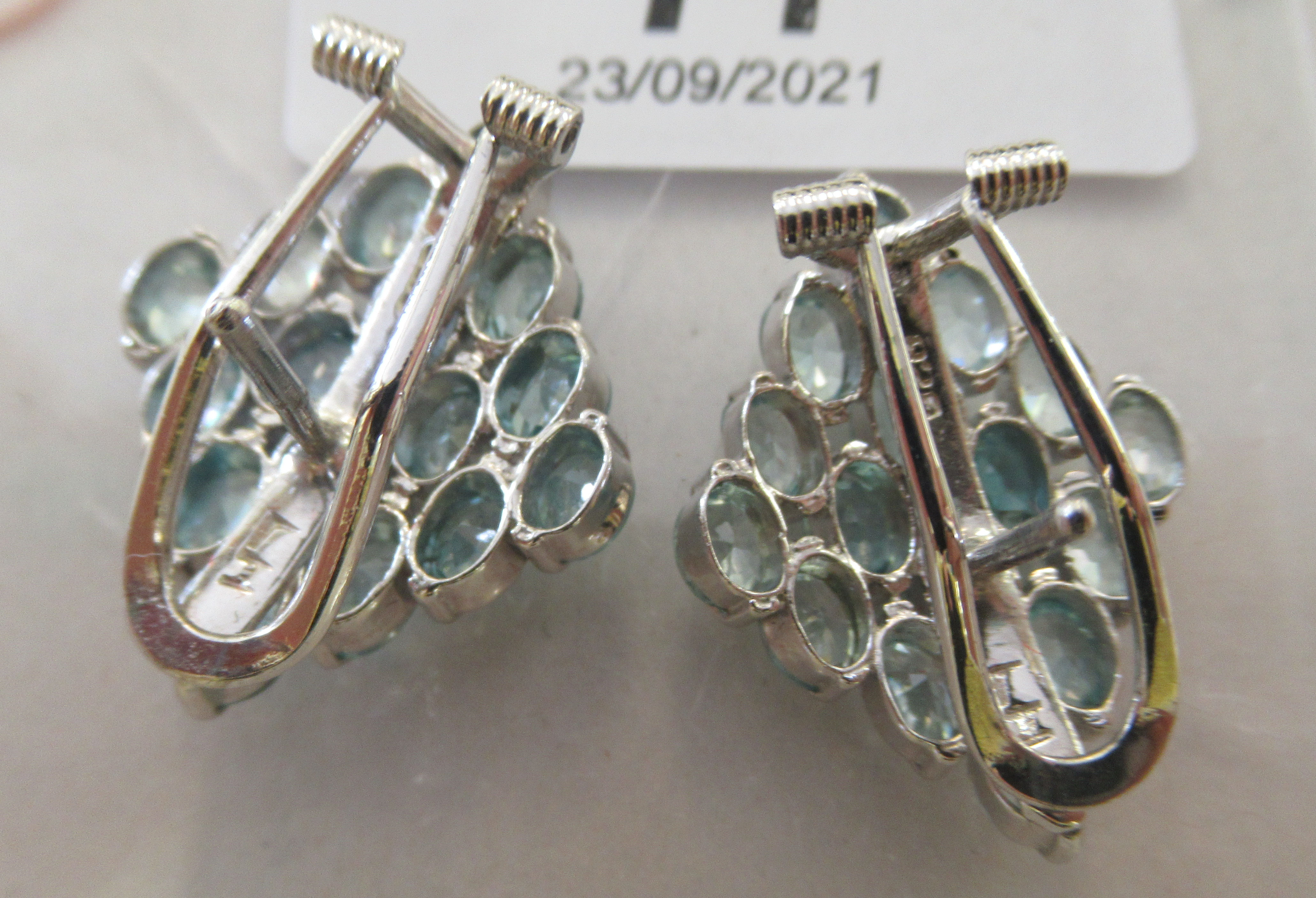 A pair of silver coloured metal earrings, set with multiple blue stones  stamped 925 - Image 2 of 2