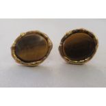 A pair of 9ct gold and tiger's eye cufflinks