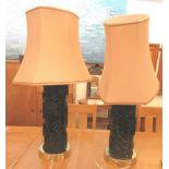 A pair of modern painted table lamps made from printing rolls, having applied wire floral and