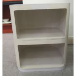 A modern Kartell, Castelli, cream coloured moulded plastic, two tier, stacking, tray-top shelf unit