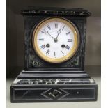 A late 19thC French mottled green marble and black slate cased mantel clock; the bell strike