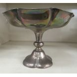 An Edwardian silver tazza with a wavy edge bowl, on a pedestal foot  London 1902  8"dia