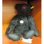 A Steiff black mohair Teddy bear with mobile limbs and a growler  16"h