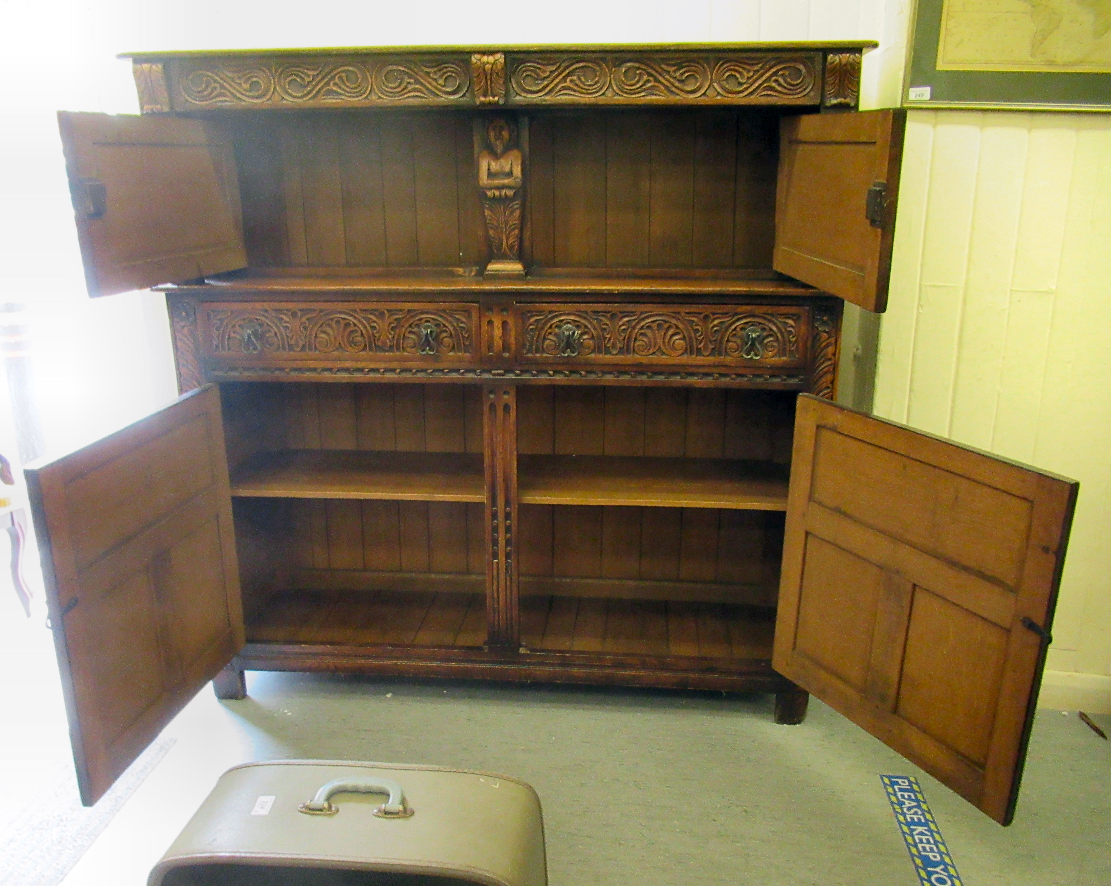 A 1920s/30s carved oak court cupboard, the frieze drawer over a pair of recessed doors and outset - Image 3 of 4