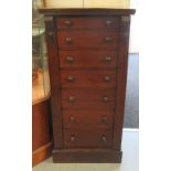 A late Victorian mahogany Wellington chest, comprising seven graduated short drawers with bun