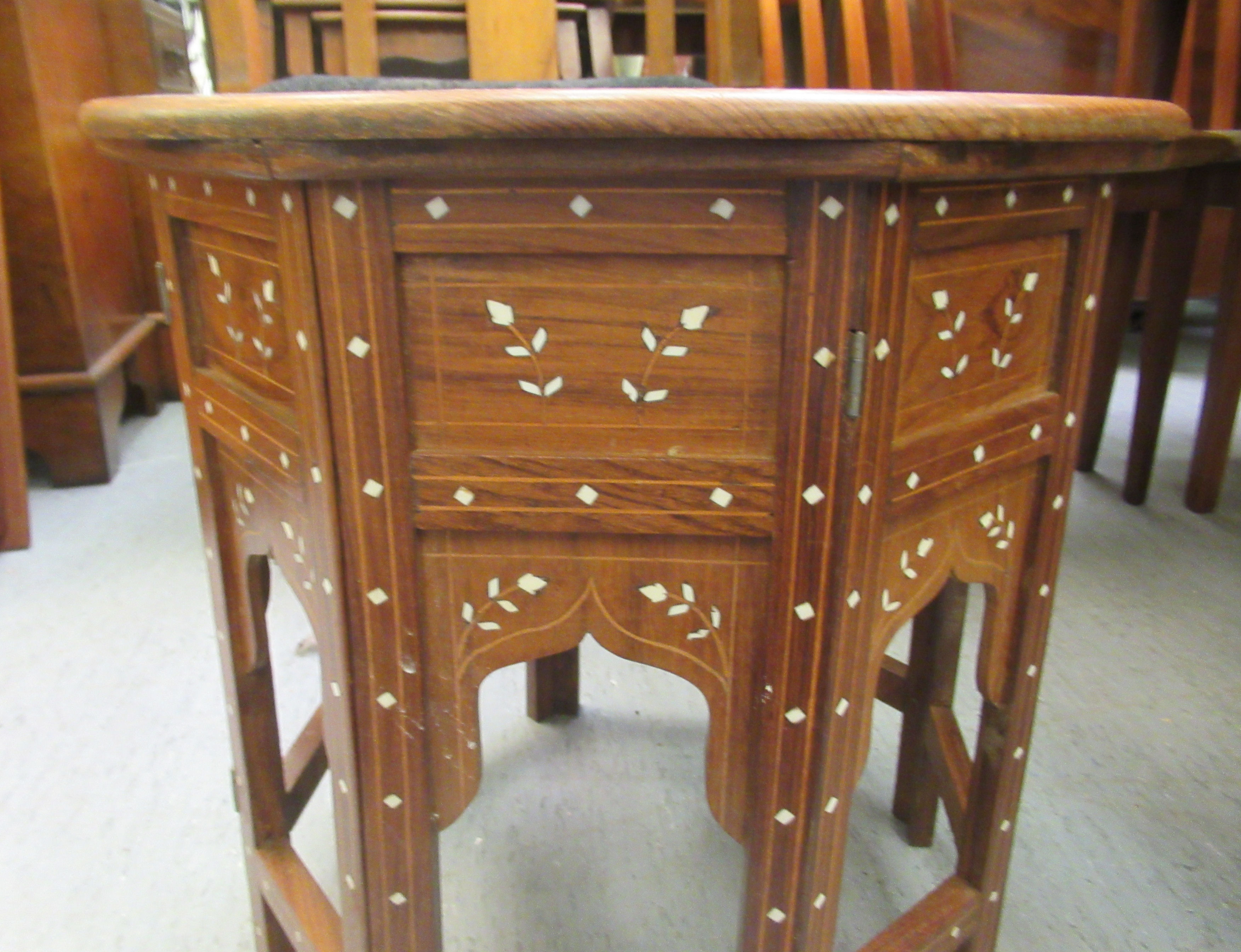 A 20thC Indian bone inlaid fruitwood occasional table, decorated with floral designs  18"h  18"dia - Image 3 of 4