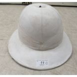 A shabby chic painted reproduction of a pith helmet