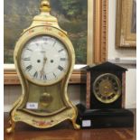 A late Victorian black slate and mottled red marble cased mantel timepiece; the movement faced by