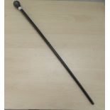 A late 19thC turned fruitwood walking cane with a white metal ball finial  35"L overall