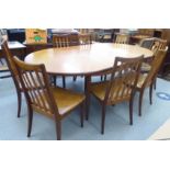 A G-Plan teak dining table, the two demi-lune ends raised on turned, tapered legs with an integral