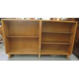 A 1970s Vanson bleached teak, open front, dwarf bookcase with height adjustable shelves, raised on