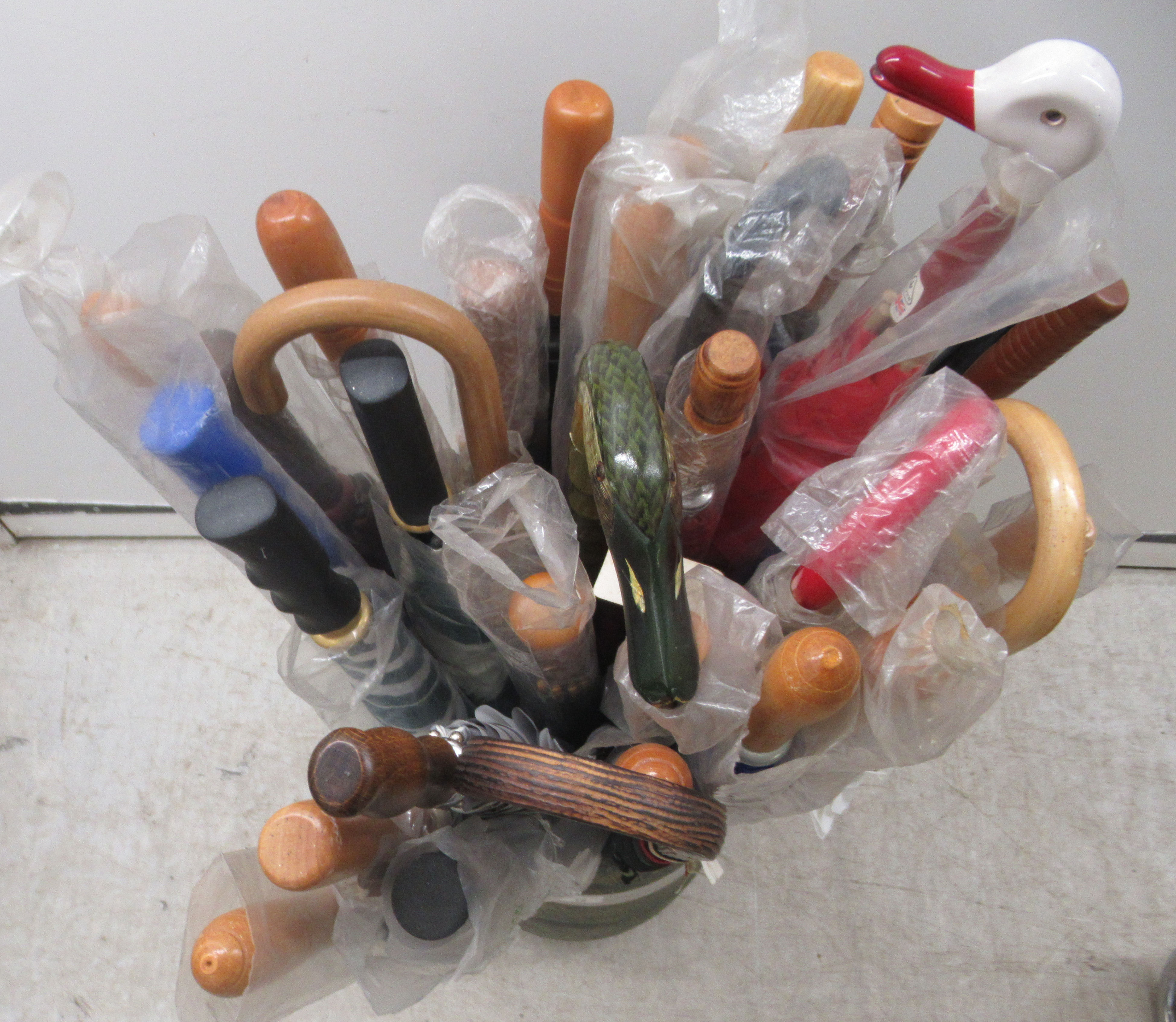 Modern walking aids and umbrellas, contained ; in a twin handled stoneware vase  17"h - Image 3 of 3