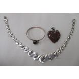 Silver jewellery, viz. a bangle; a heart shaped pendant; and a necklace