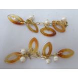 A pair of gold coloured metal, pearl and amber coloured oval ring pendant earrings