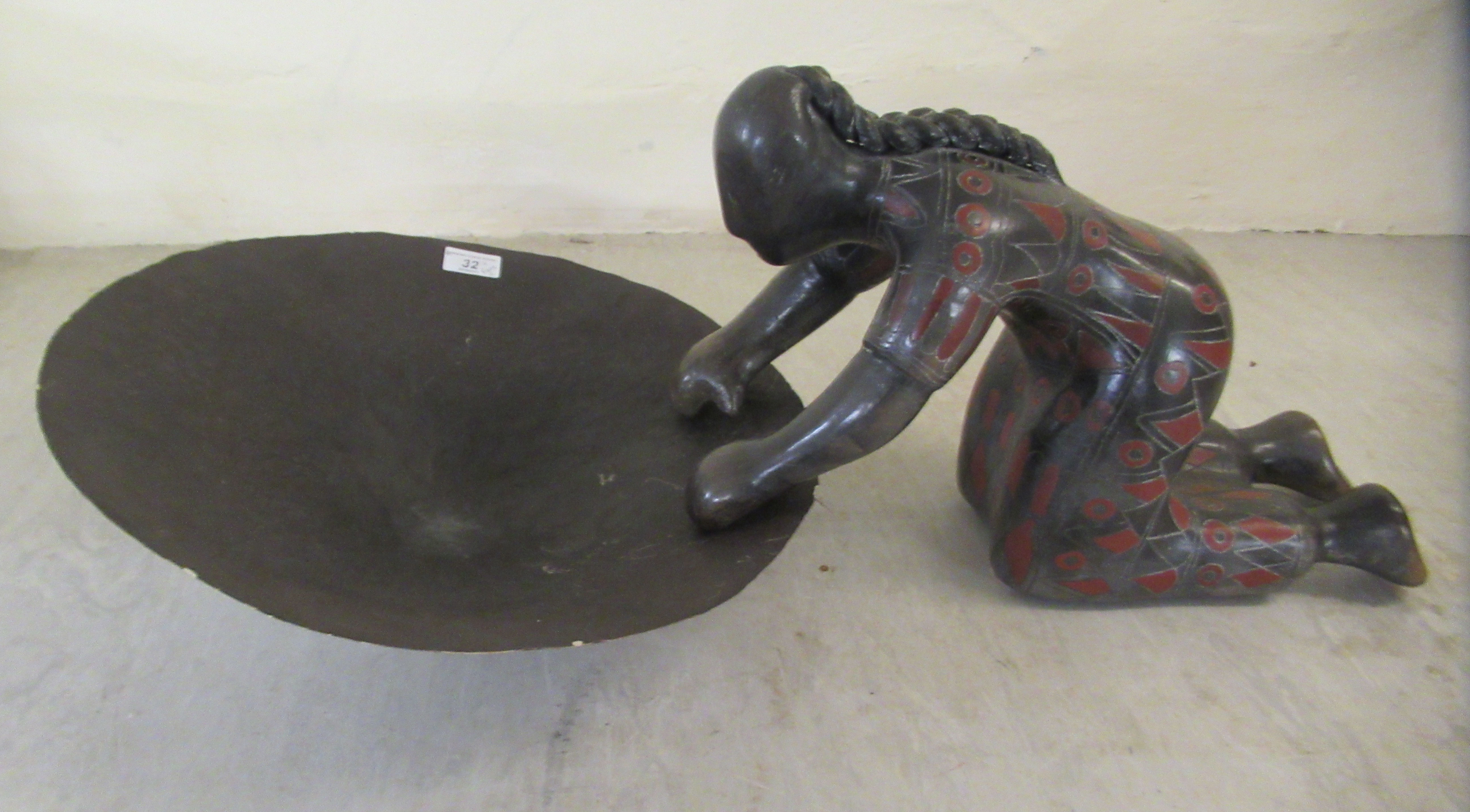 A studio pottery figure, kneeling beside a bowl  16"h