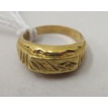 A Chinese yellow metal ring  bears a character mark & stamped 100%